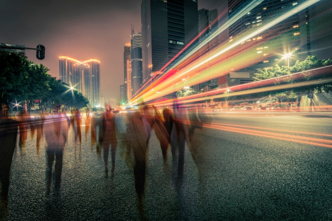 Traffic on a street at night, long exposure.